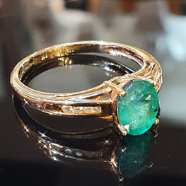 Emerald and Diamond ring set on 9ct Yellow Gold