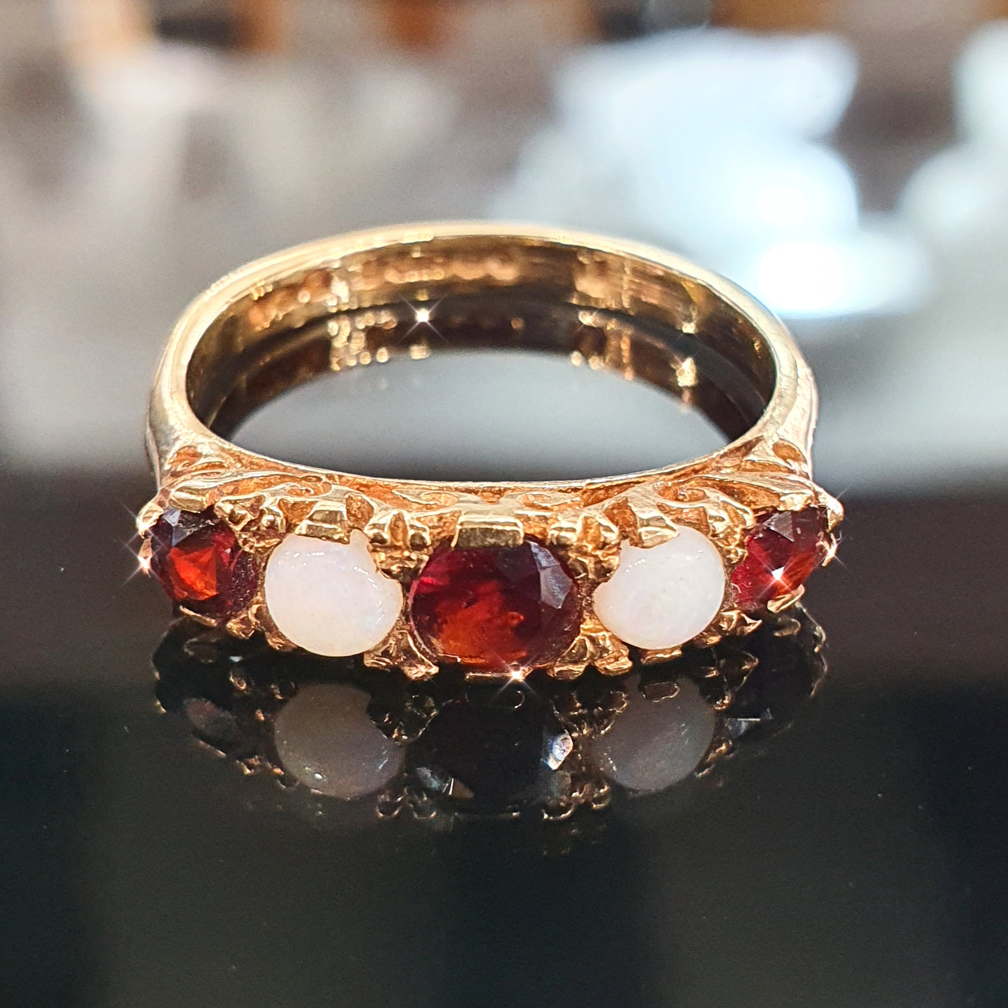 Opal and Garnet Ring set on 9ct Yellow Gold